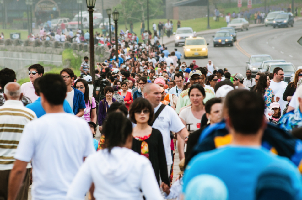 Thousands of tourists walk the Promenade at Niagara Falls, Ontario